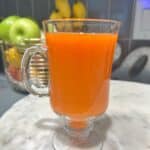 Refreshing homemade carrot orange ginger juice, a vibrant blend of flavors packed with vitamins and antioxidants. Healthy and delicious beverage for a boost of energy and immunity - kleanlivingwithkole.com